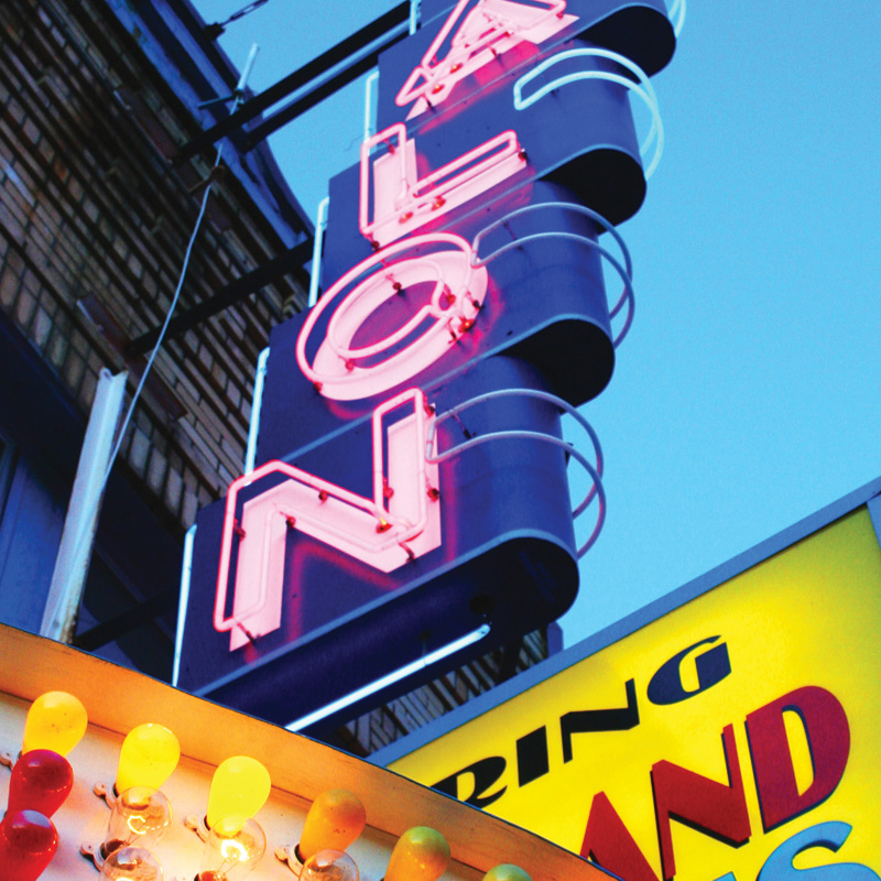 Photo of a neon sign with a vivid blue background